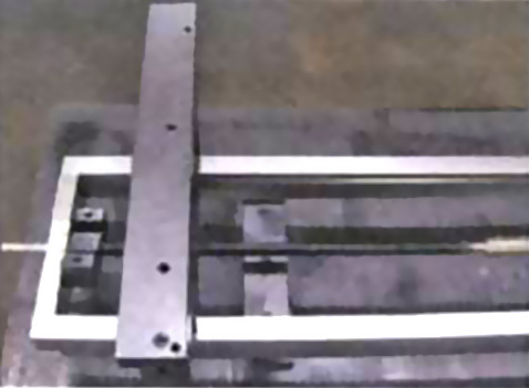 Bolt Block bar spacer plates to parallels. Have facing inward. Keep allen bolts loose until alignment bars are installed.